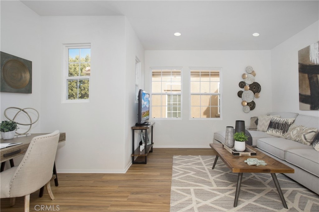 10 Bel Spring Irvine, CA 92602 - Photo 7 of 35 a living room with furniture and a flat screen tv