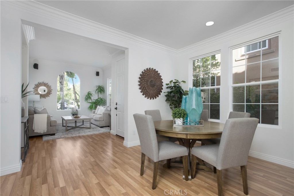 10 Bel Spring Irvine, CA 92602 - Photo 9 of 35 a dining room with furniture and wooden floor