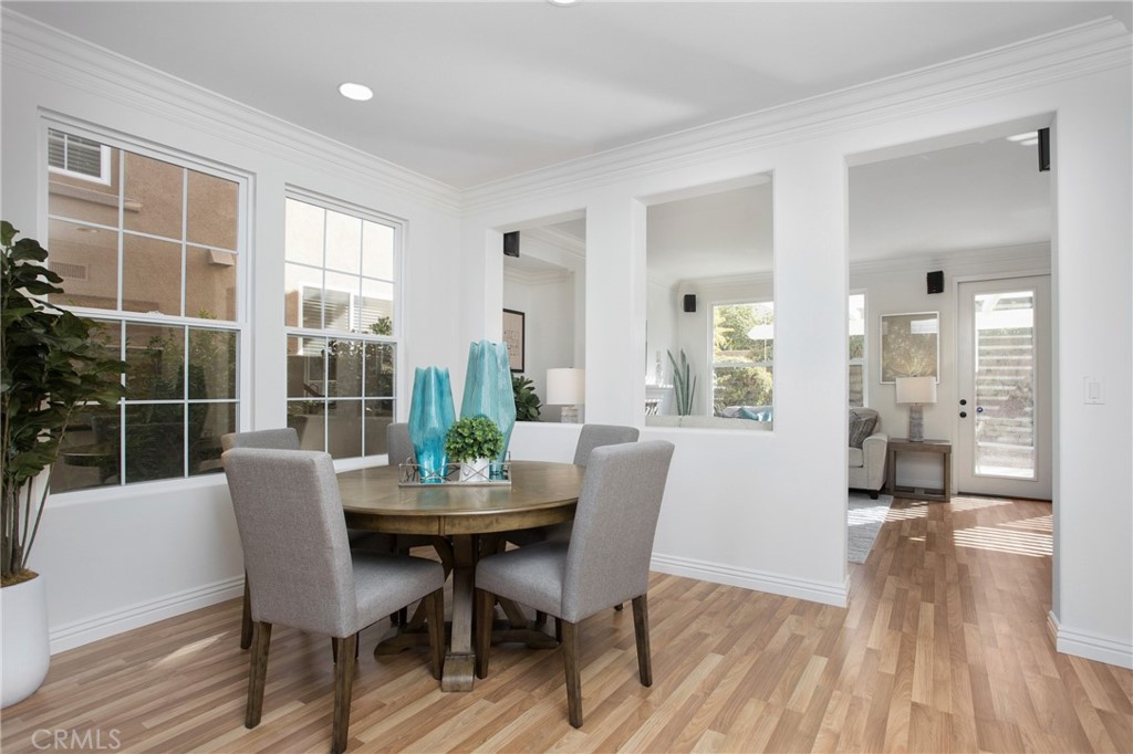 10 Bel Spring Irvine, CA 92602 - Photo 10 of 35 a dining room with furniture and wooden floor