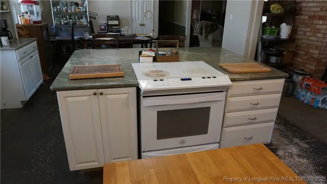 a kitchen with a stove and a sink