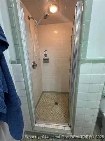 a view of storage and utility room with washer and dryer