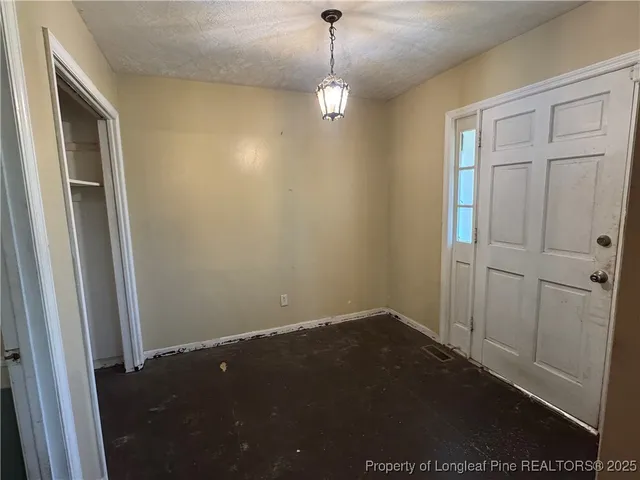 a view of a hallway with closet