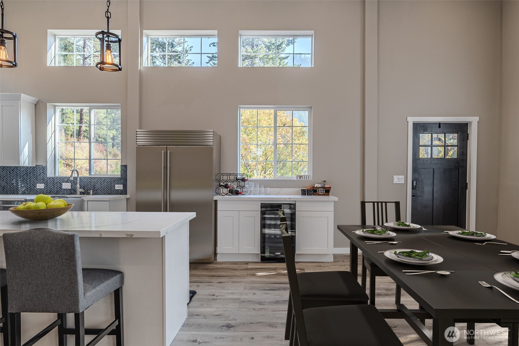 10642 Merry Canyon Road Leavenworth, WA 98826 - Photo 11 of 36 a kitchen with a table chairs and a refrigerator