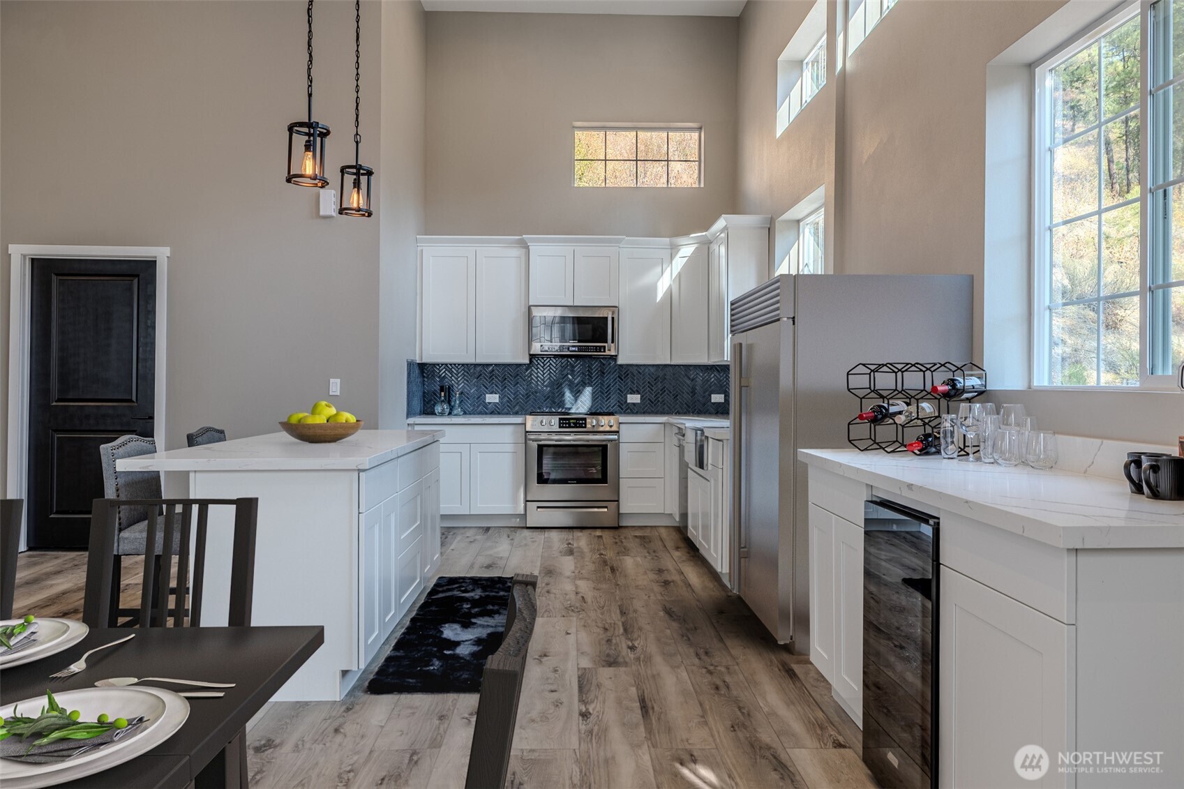 10642 Merry Canyon Road Leavenworth, WA 98826 - Photo 13 of 36 a kitchen with a white stove top oven sink and cabinets