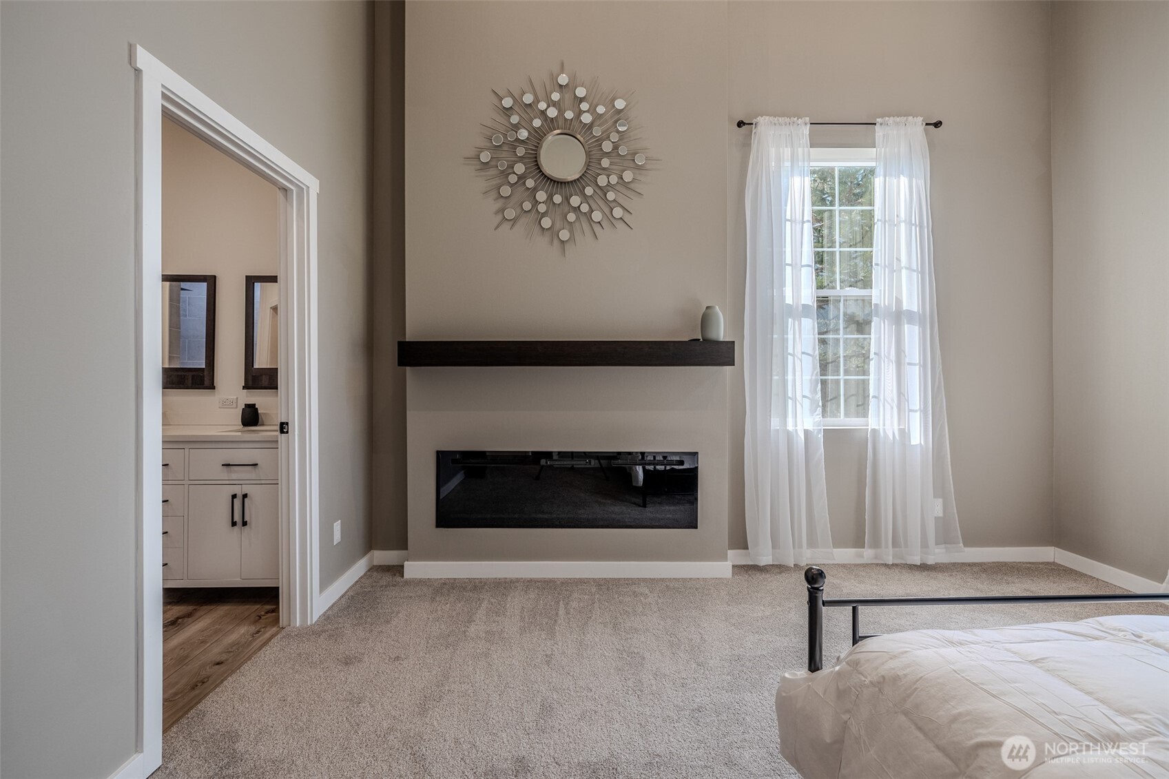 10642 Merry Canyon Road Leavenworth, WA 98826 - Photo 17 of 36 an empty room with windows and fireplace