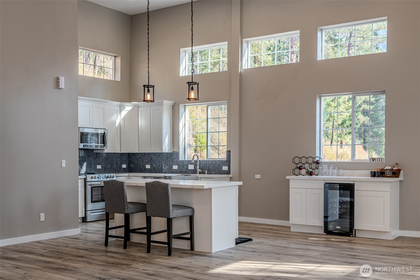 10642 Merry Canyon Road Leavenworth, WA 98826 - Photo 33 of 36 a kitchen with cabinets table and chairs