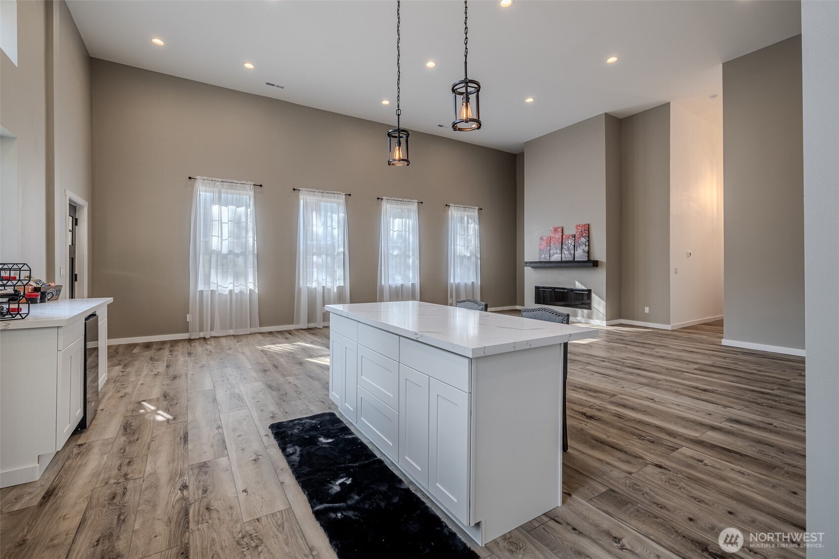 10642 Merry Canyon Road Leavenworth, WA 98826 - Photo 36 of 36 a large kitchen with stainless steel appliances a large counter top and a wooden floors