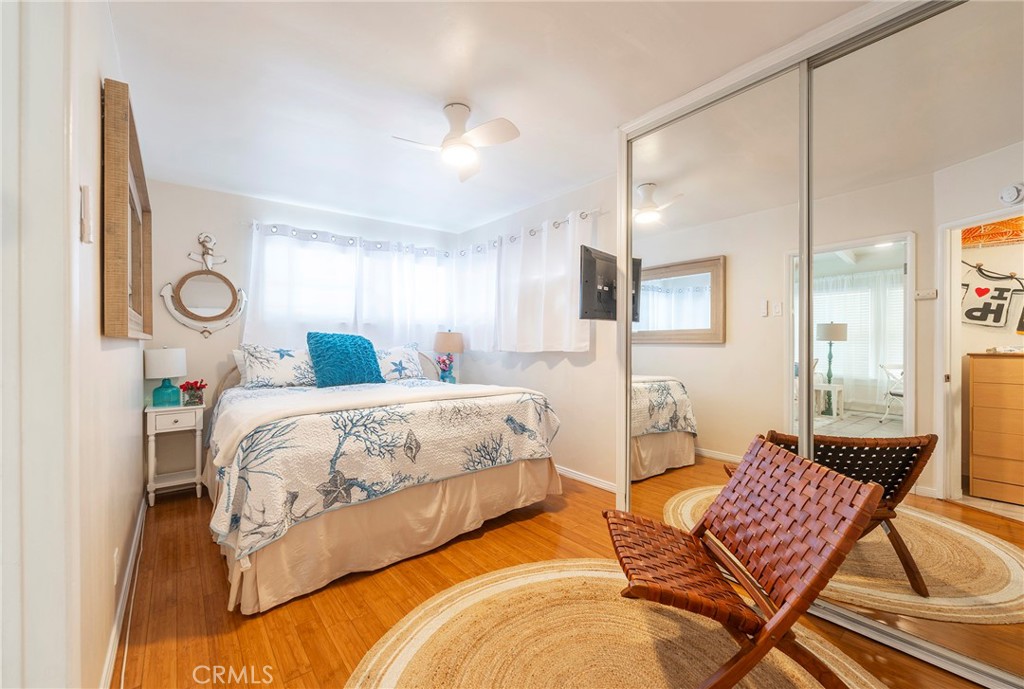 1728 The Strand, Unit 4 Hermosa Beach, CA 90254 - Photo 11 of 23 a spacious bedroom with a bed and window