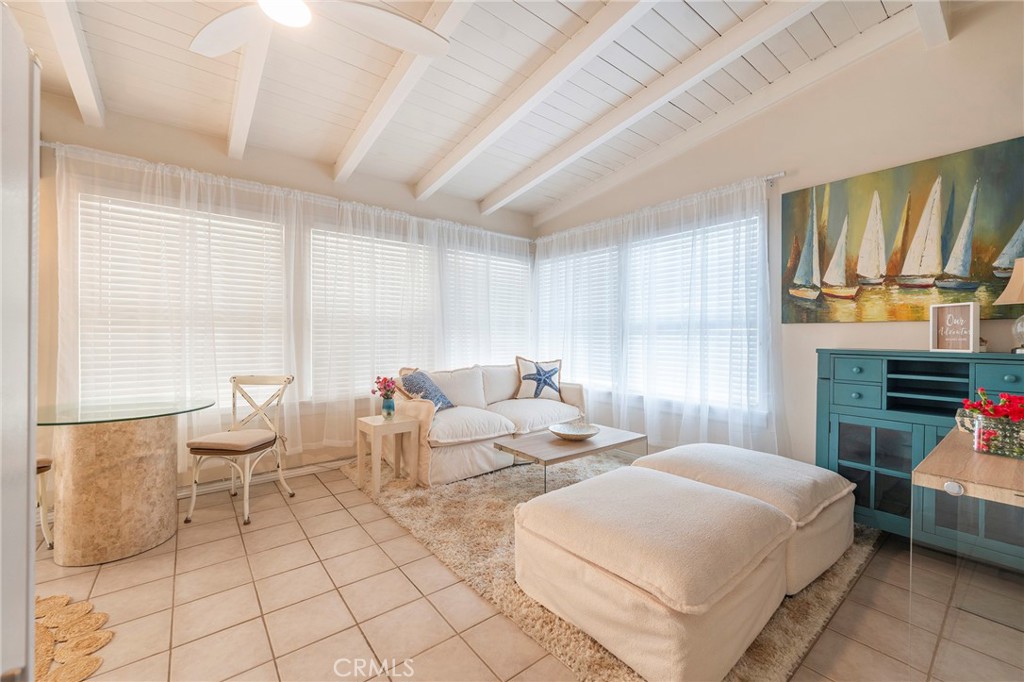 1728 The Strand, Unit 4 Hermosa Beach, CA 90254 - Photo 16 of 23 a bedroom with a bed a large mirror and a large window