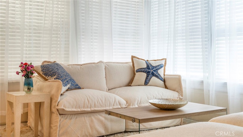 1728 The Strand, Unit 4 Hermosa Beach, CA 90254 - Photo 3 of 23 a living room with furniture and a potted plant