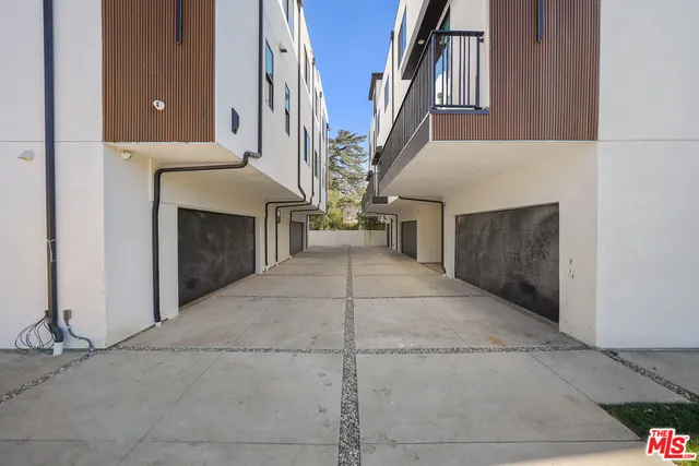 a view of a house with a street