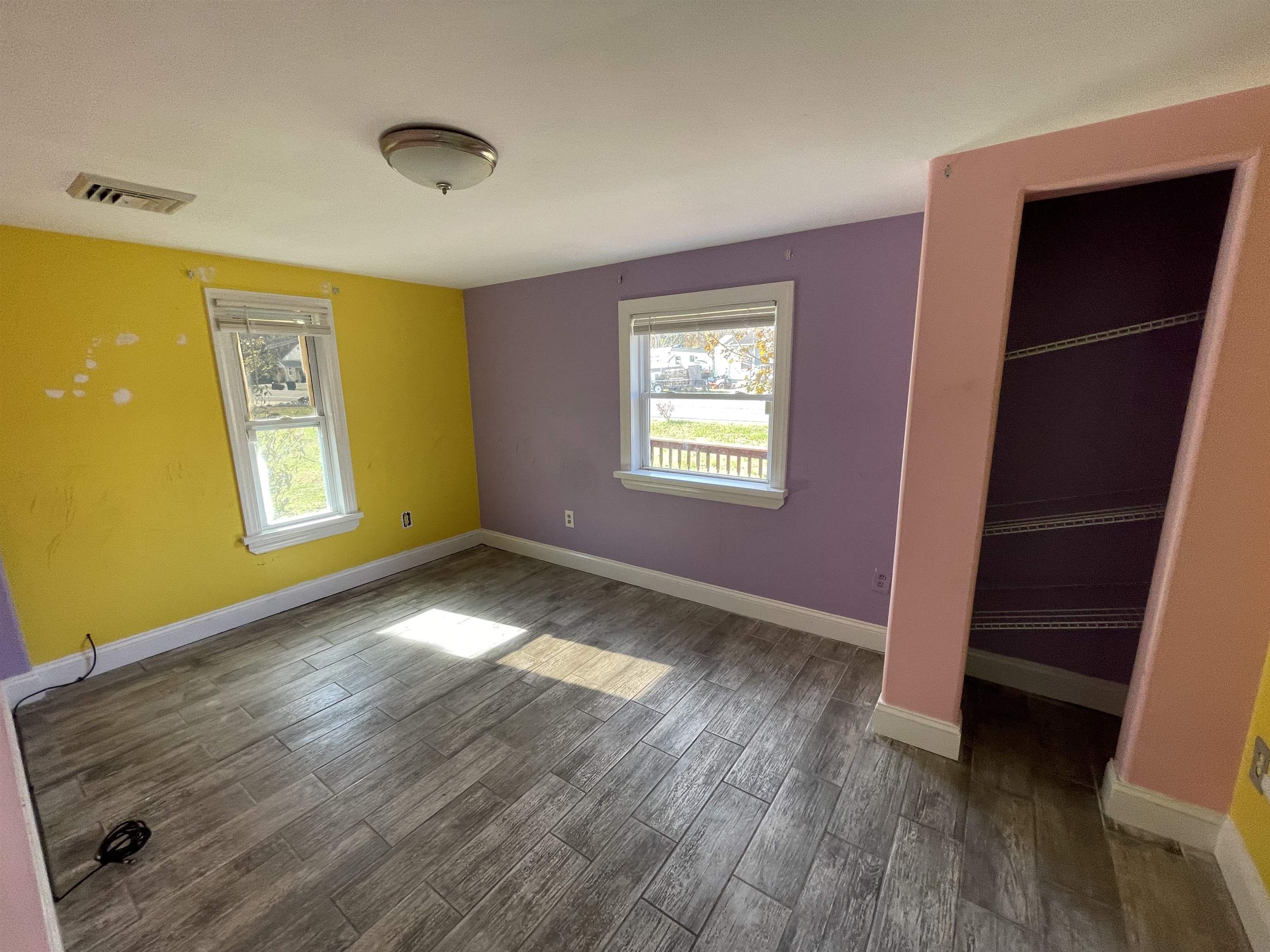 1658 North Port Norris, NJ 08349 - Photo 17 of 34 a view of an empty room with wooden floor and a window