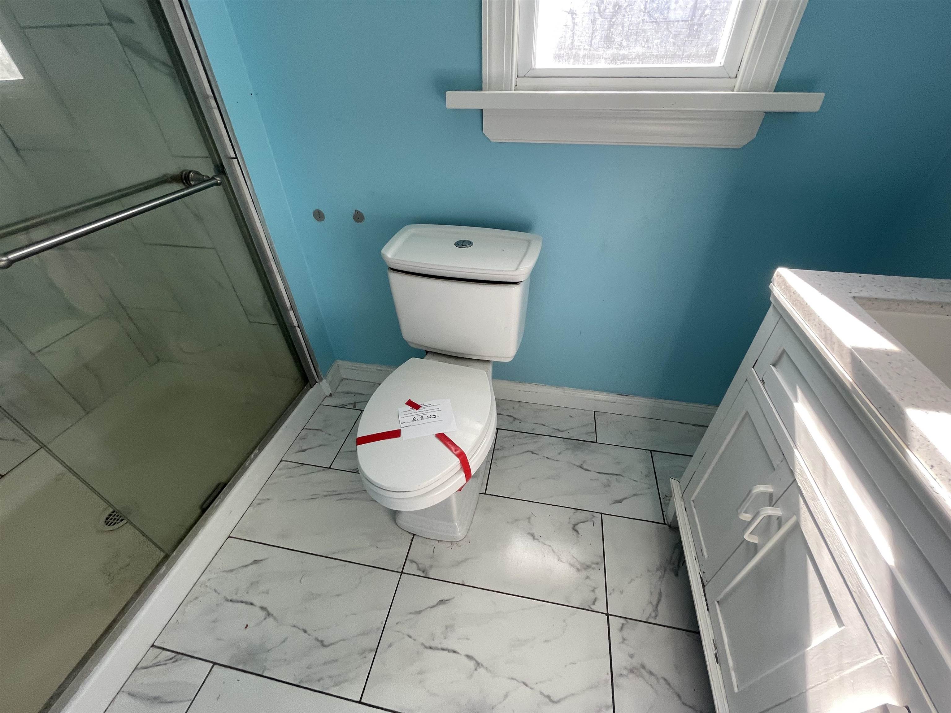1658 North Port Norris, NJ 08349 - Photo 22 of 34 a bathroom with a toilet and a rug