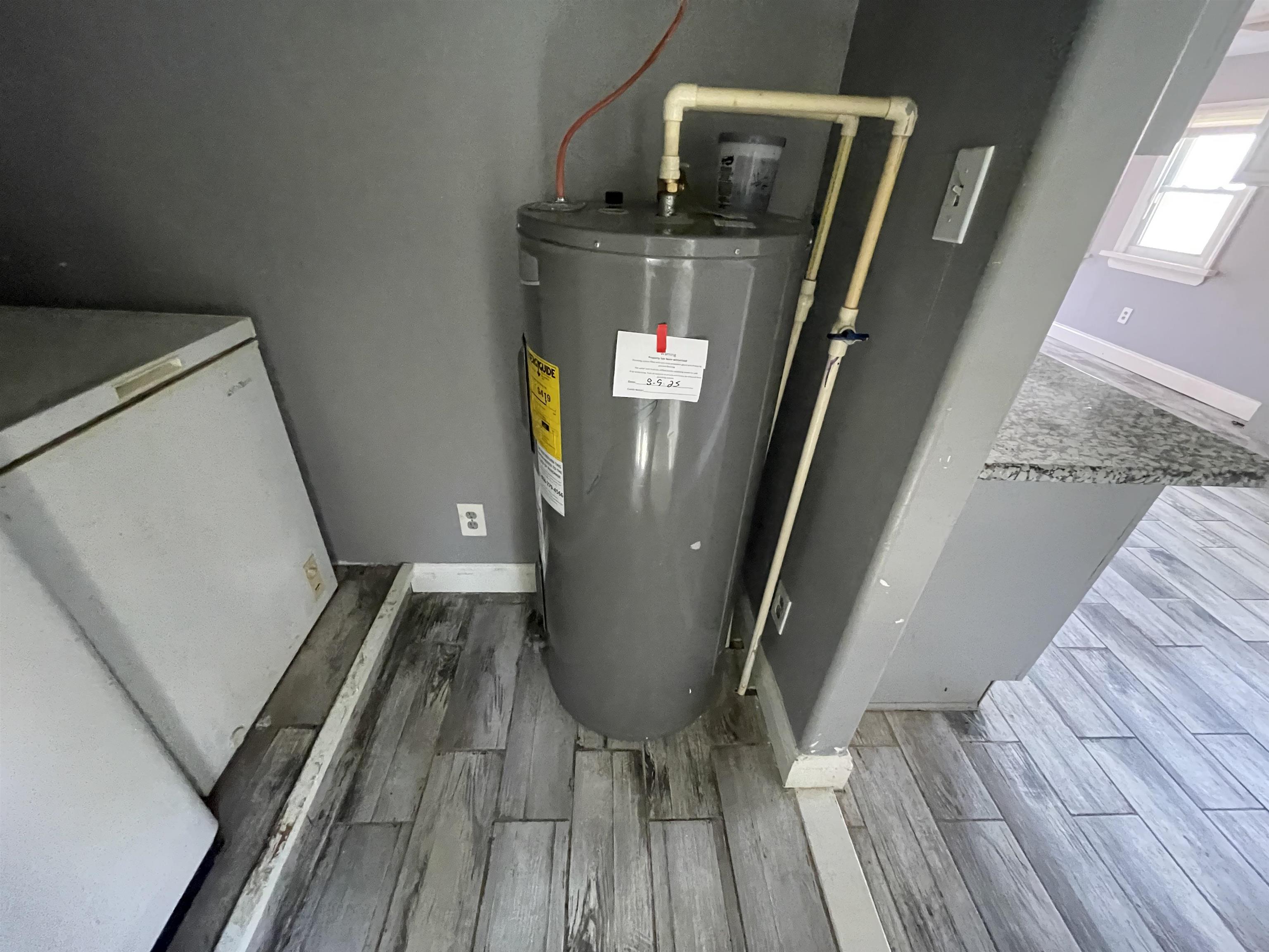 1658 North Port Norris, NJ 08349 - Photo 29 of 34 a view of washer and dryer with wooden floor