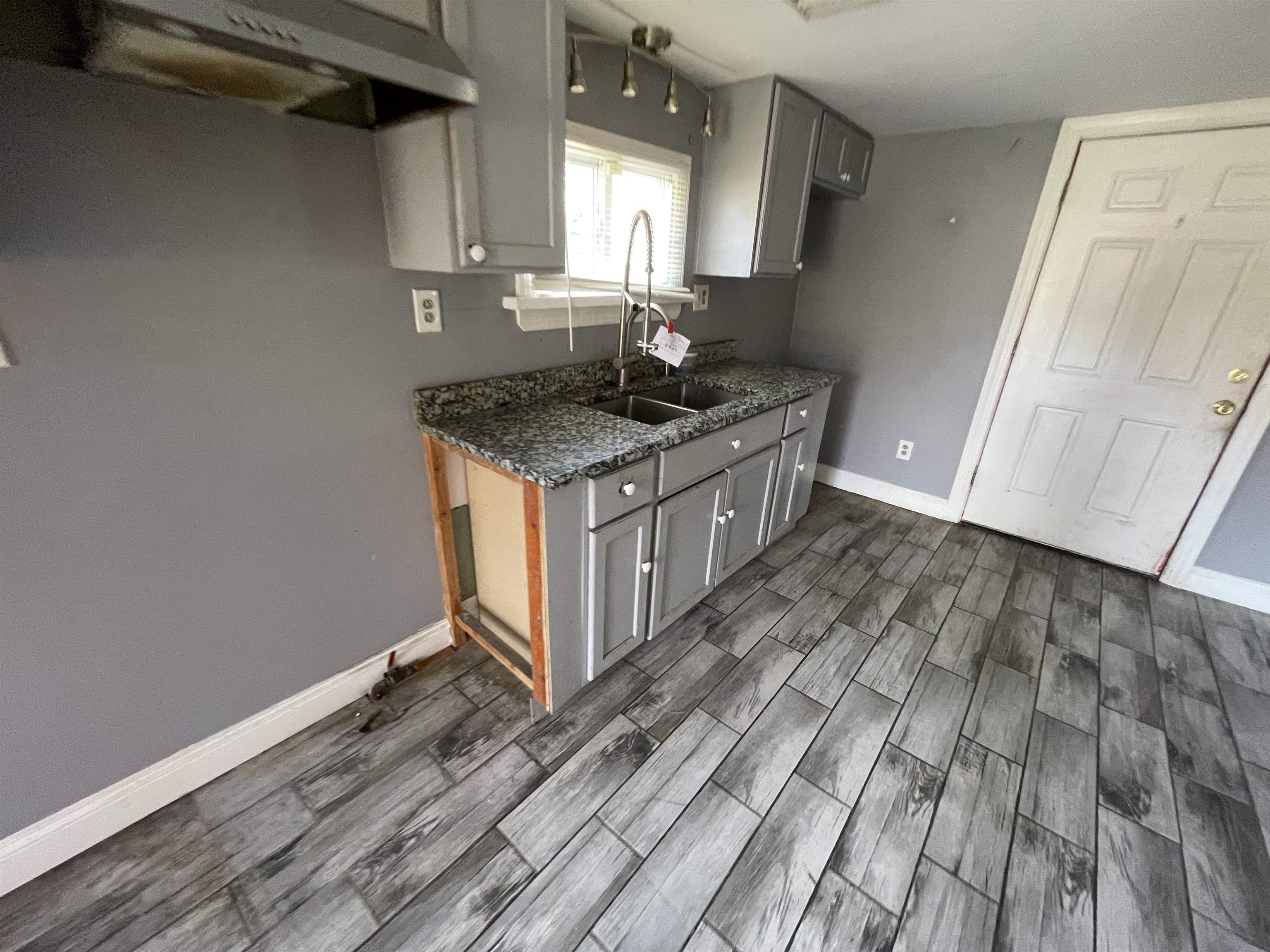 1658 North Port Norris, NJ 08349 - Photo 9 of 34 a kitchen with a sink stove and cabinets