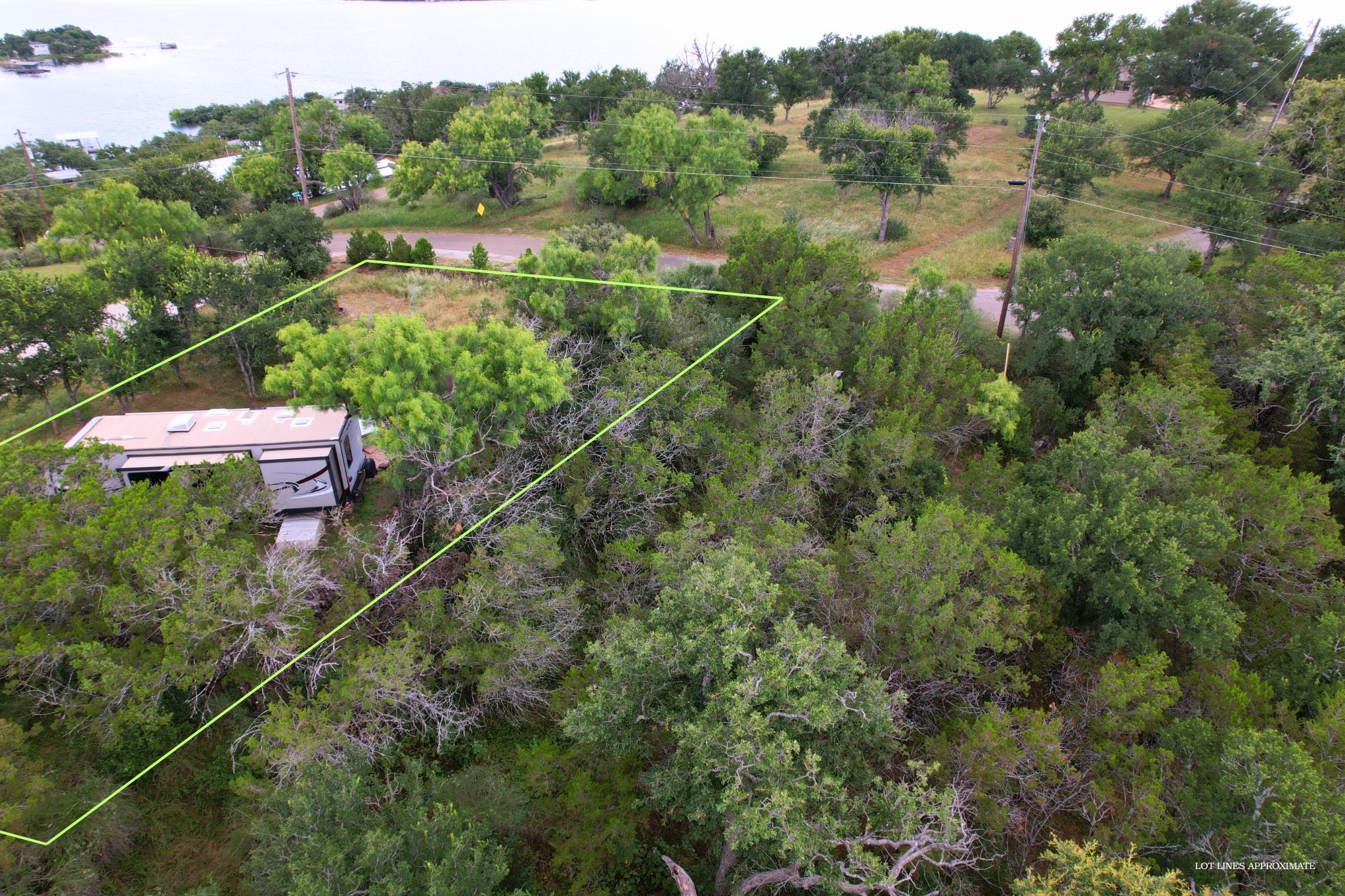 706 Cr138a Road Burnet, TX 78611 - Photo 6 of 18 A semi cleared lot with mature trees offers a private retreat near the water's edge.