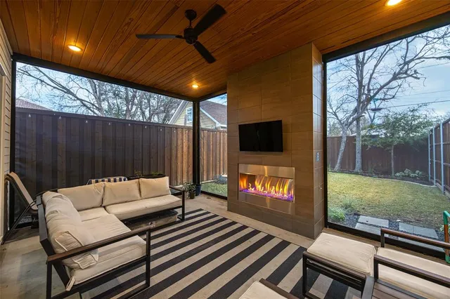 a outdoor living space with furniture and a fireplace