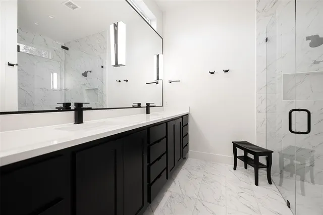 an aerial view of residential houses with city view