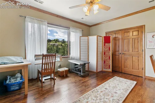 a view of a livingroom with furniture and a window