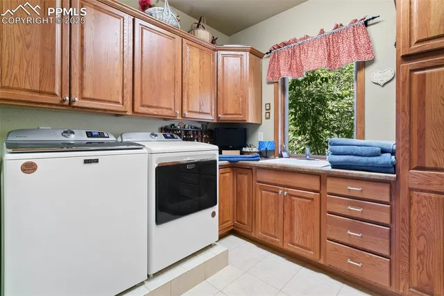 a kitchen with a sink a stove and cabinets
