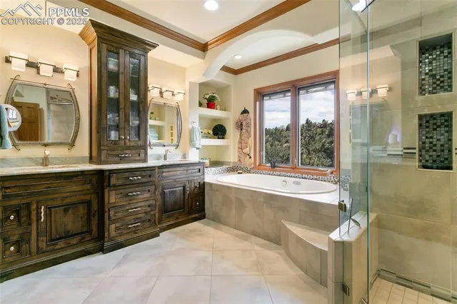 a spacious bathroom with a granite countertop tub sink shower and mirror