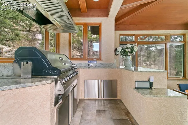 a view of a livingroom with furniture and staircase