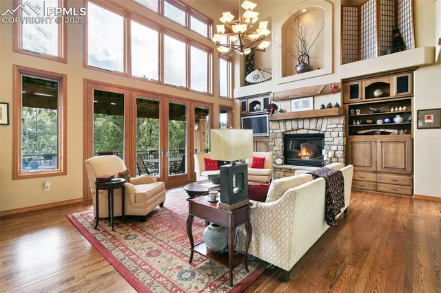 a living room with furniture fireplace and window