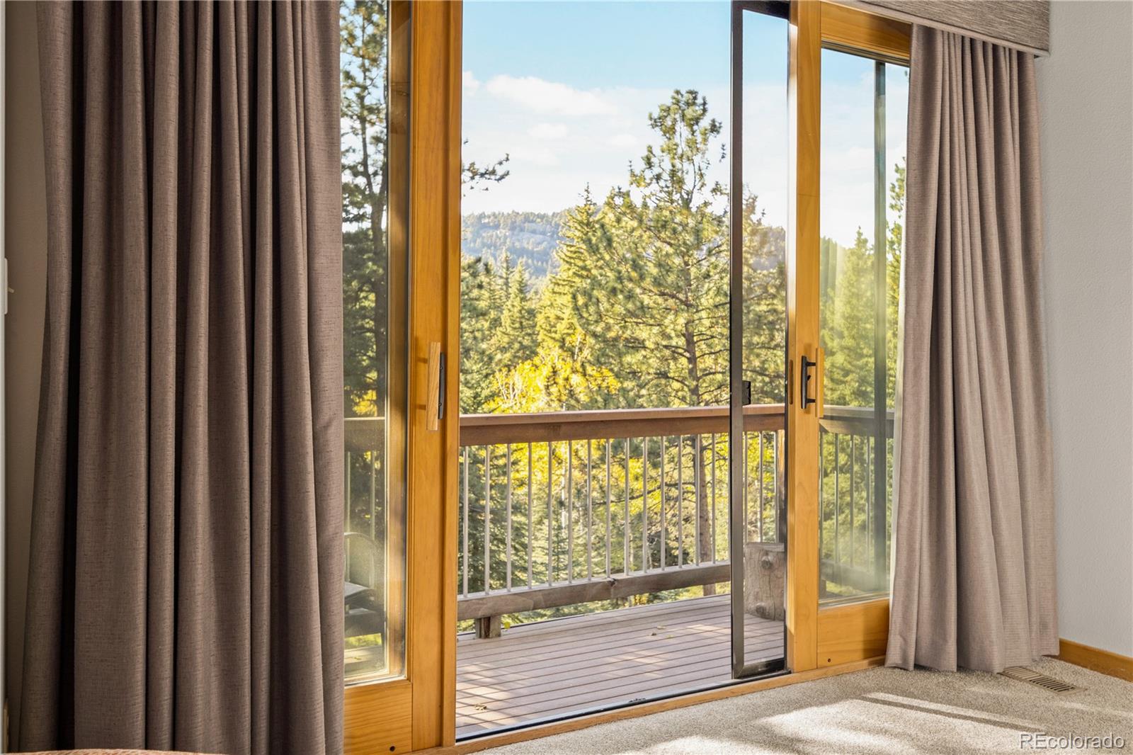 32217 Buffalo Park Road Evergreen, CO 80439 - Photo 12 of 46 a view of a city from a window