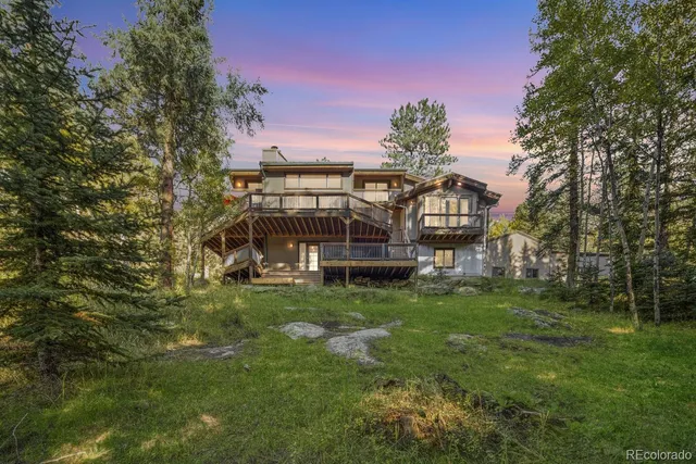 a view of a house with a big yard