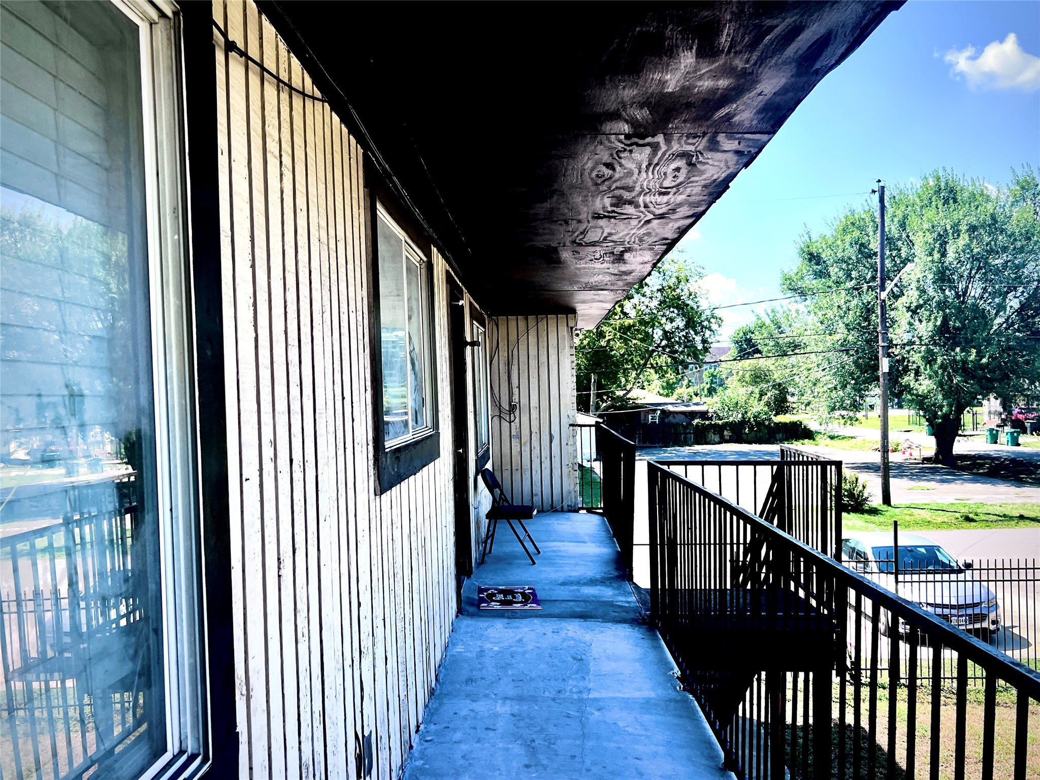 6802 Sayers Street, Unit A FEW Houston, TX 77016 - Photo 4 of 32 a view of a balcony with wooden floor