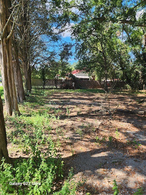2443 South Lumpkin Road Columbus, GA 31903 - Photo 12 of 13 a backyard of a house with lots of green space and lake view