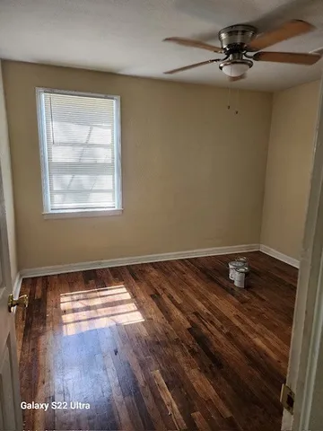 a view of an empty room and window