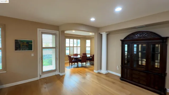a view of dining room with furniture and wooden floor