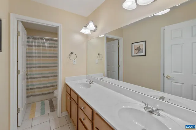 an empty room with a window and a bathroom