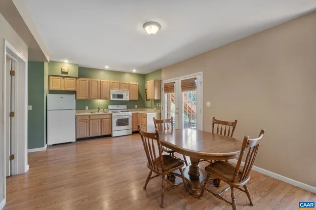 a living room with furniture flat screen tv and a window