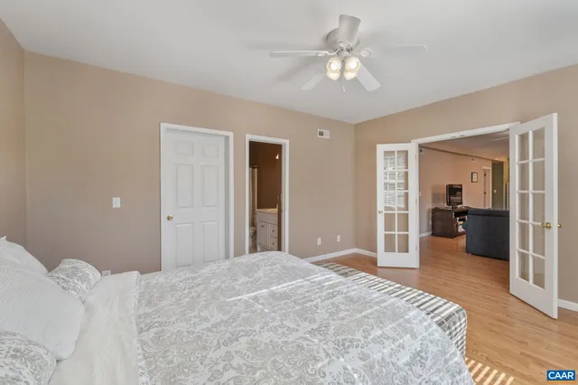 a patio with glass top table and chairs