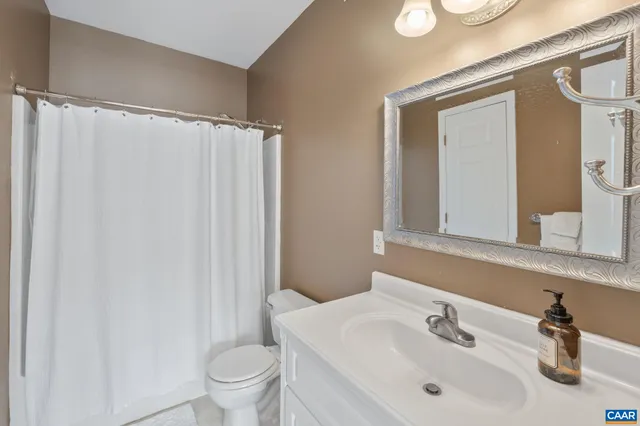 a view of a patio with table and chairs and wooden floor