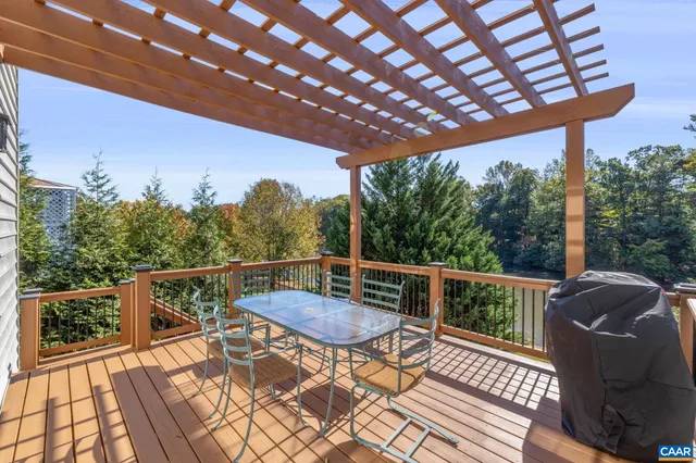a view of a house with backyard porch and sitting area