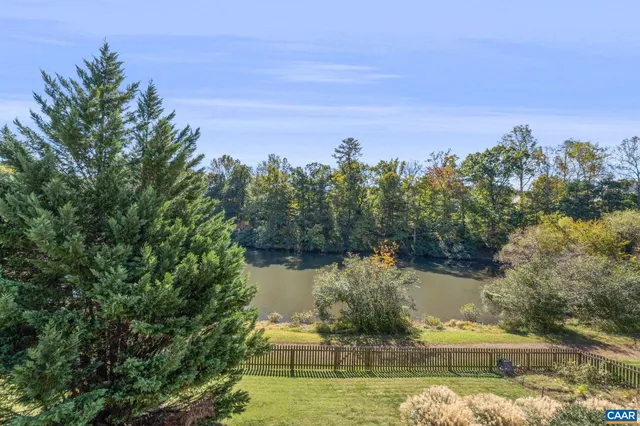 an aerial view of a city with lots of residential buildings ocean and mountain view