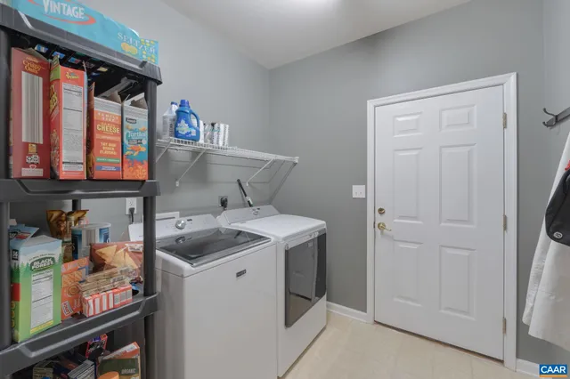 a spacious bathroom with a double vanity sink a large mirror and a bathtub