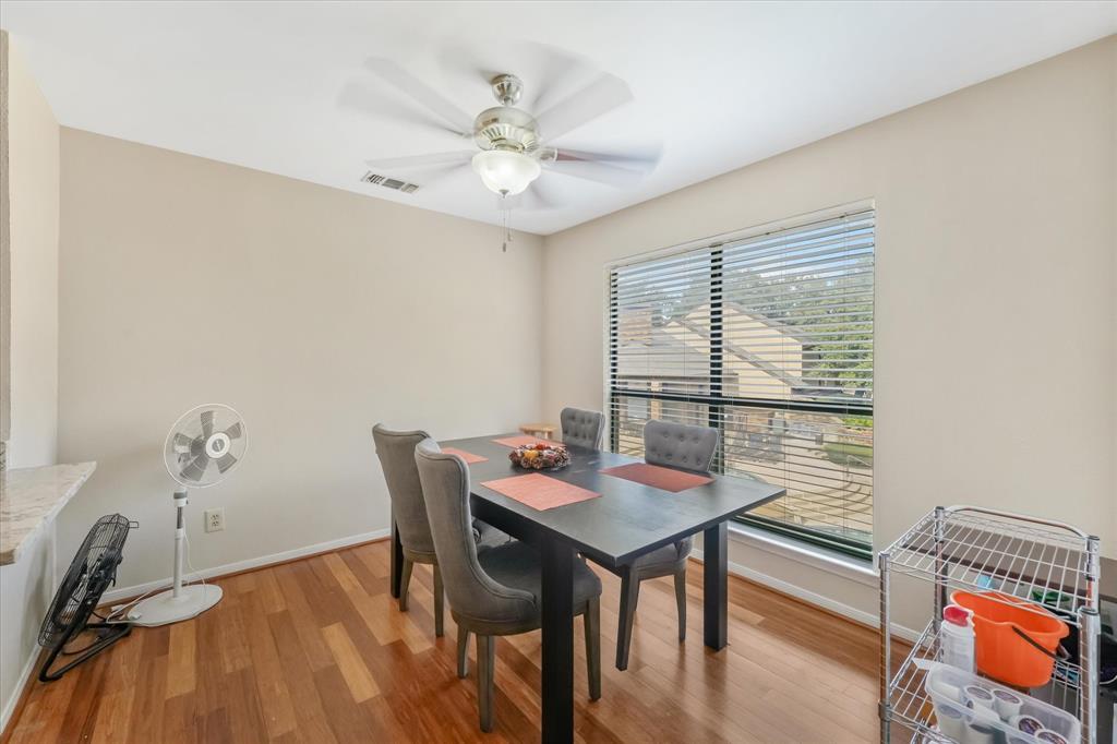 1301 Memory Lane, Unit 4924 Arlington, TX 76011 - Photo 5 of 19 Dining room with light wood finished floors and ceiling fan