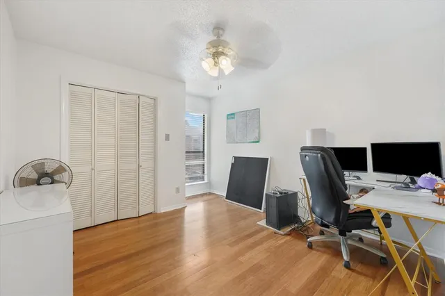 a workspace with furniture and wooden floor