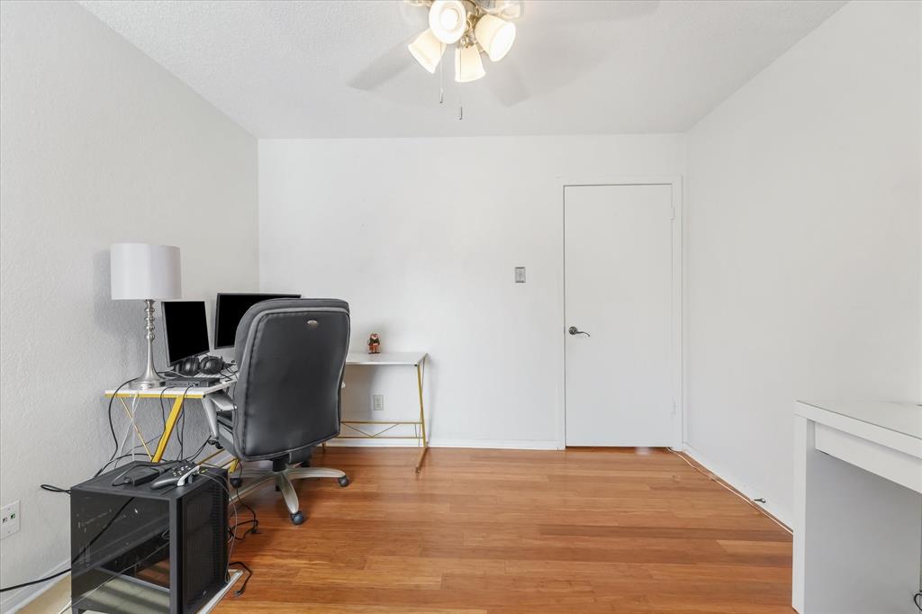 1301 Memory Lane, Unit 4924 Arlington, TX 76011 - Photo 9 of 19 Office area featuring light wood finished floors and ceiling fan