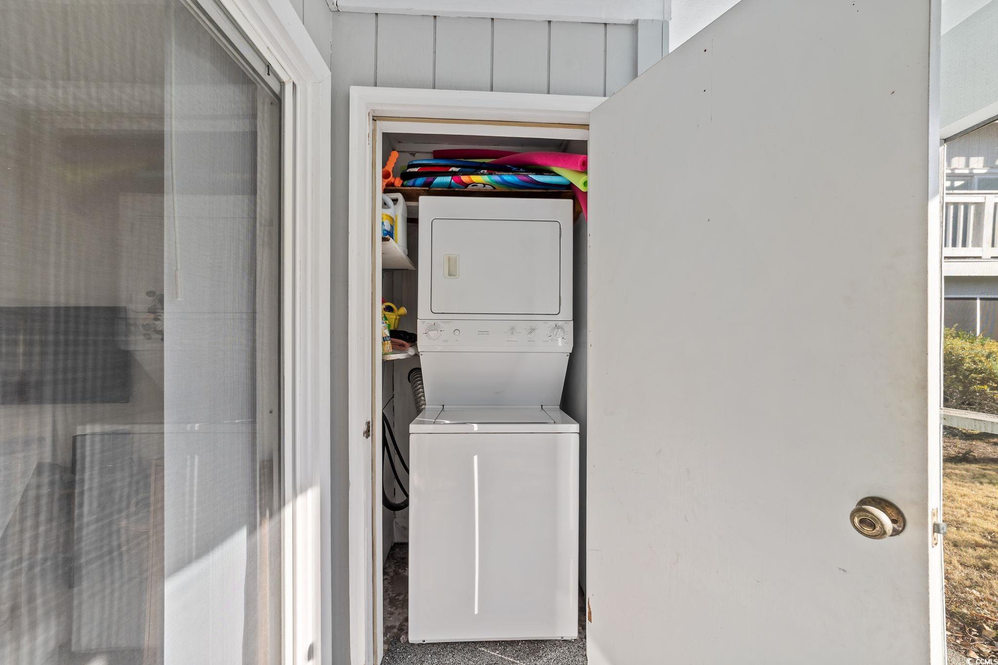 3700 Golf Colony Lane, Unit 2I Little River, SC 29566 - Photo 15 of 23 Laundry area featuring stacked washing machine and dryer