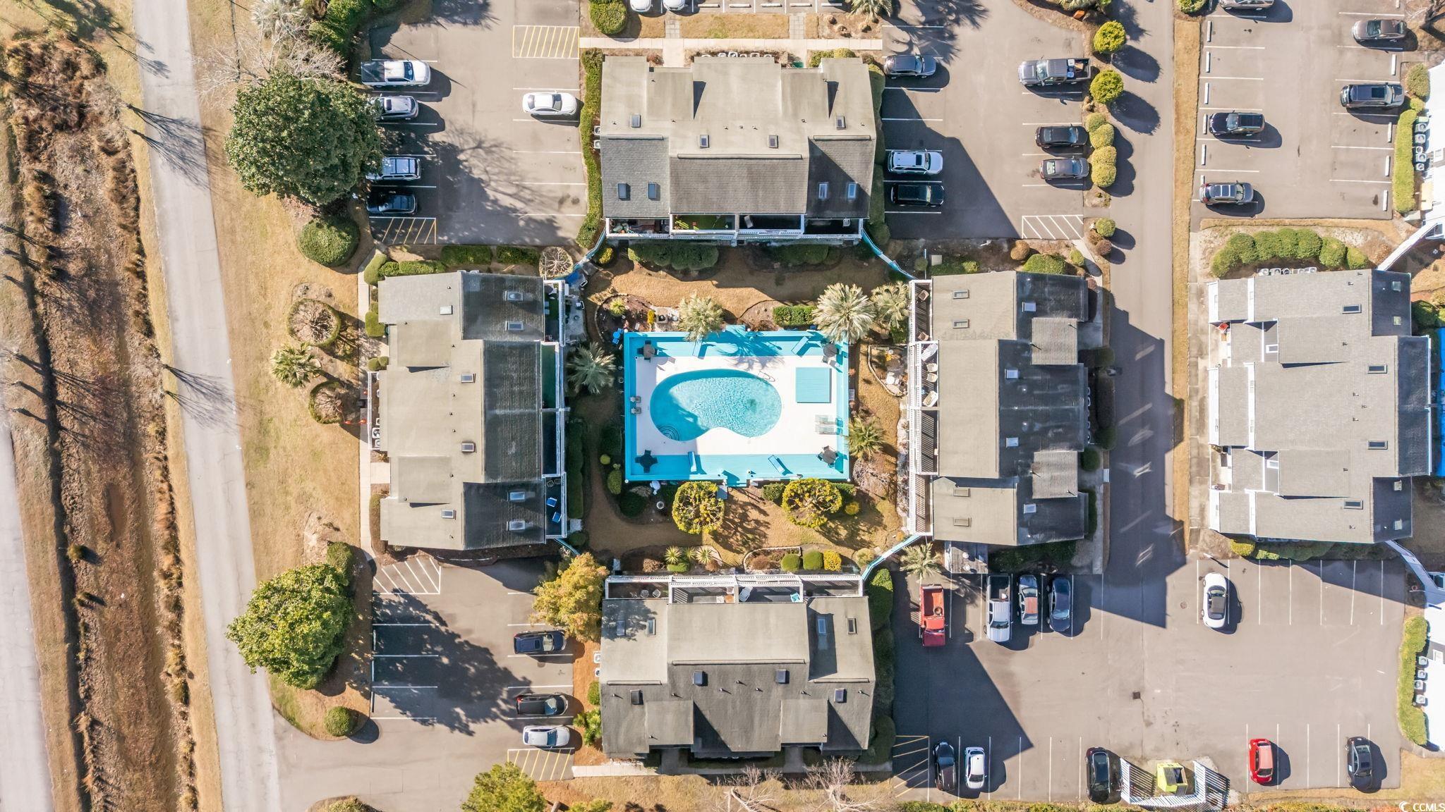 3700 Golf Colony Lane, Unit 2I Little River, SC 29566 - Photo 22 of 23 Drone / aerial view of a pool area
