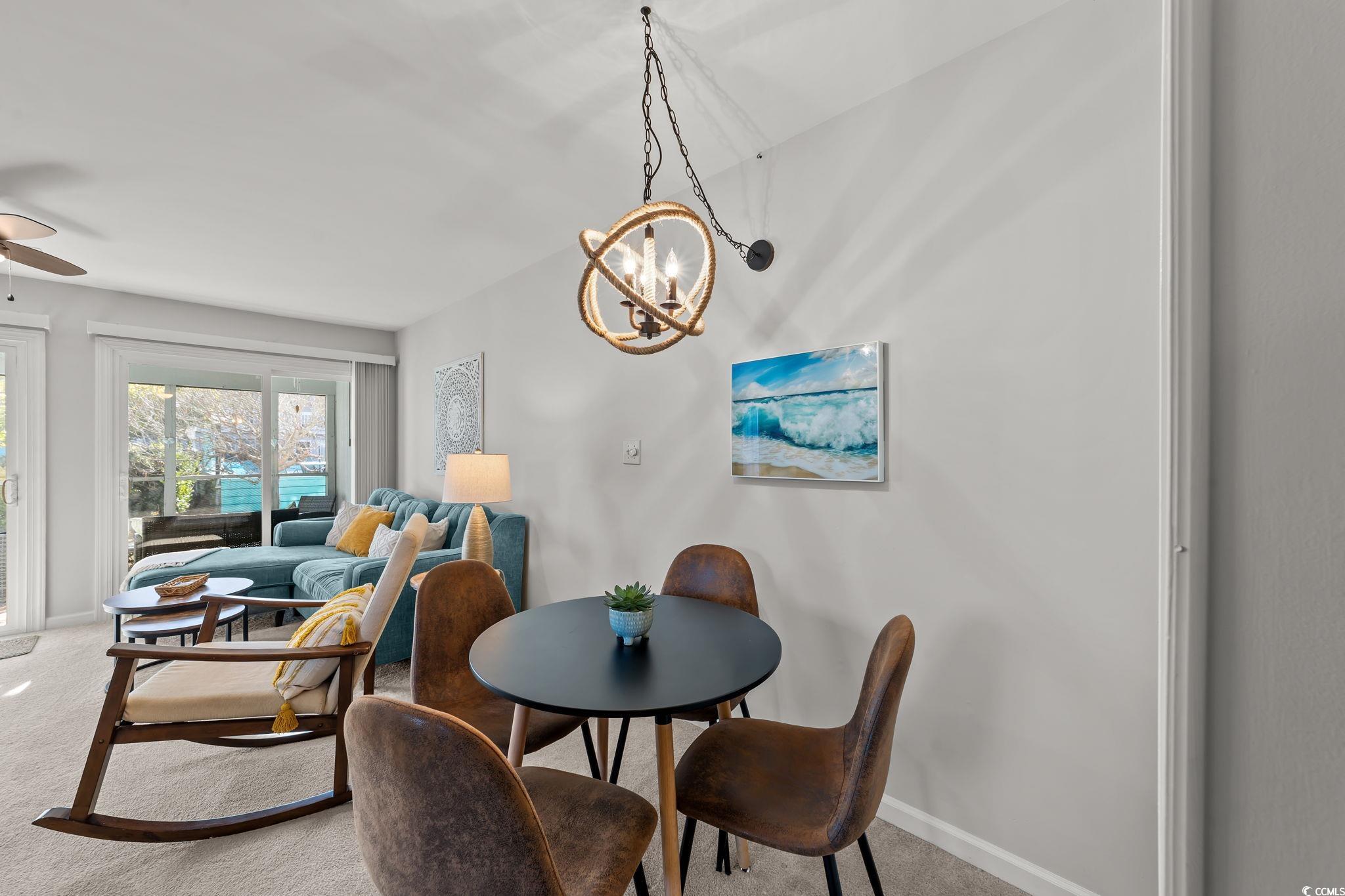 3700 Golf Colony Lane, Unit 2I Little River, SC 29566 - Photo 7 of 23 Carpeted dining space featuring ceiling fan and baseboards