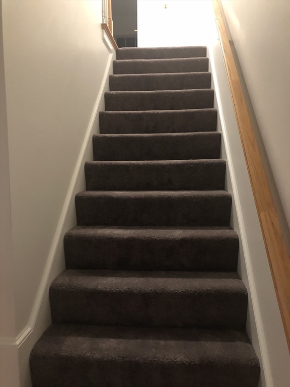41 Boston Road, Unit 174 Billerica, MA 01862 - Photo 4 of 9 a view of staircase with white walls