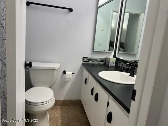 a bathroom with a shower and a toilet