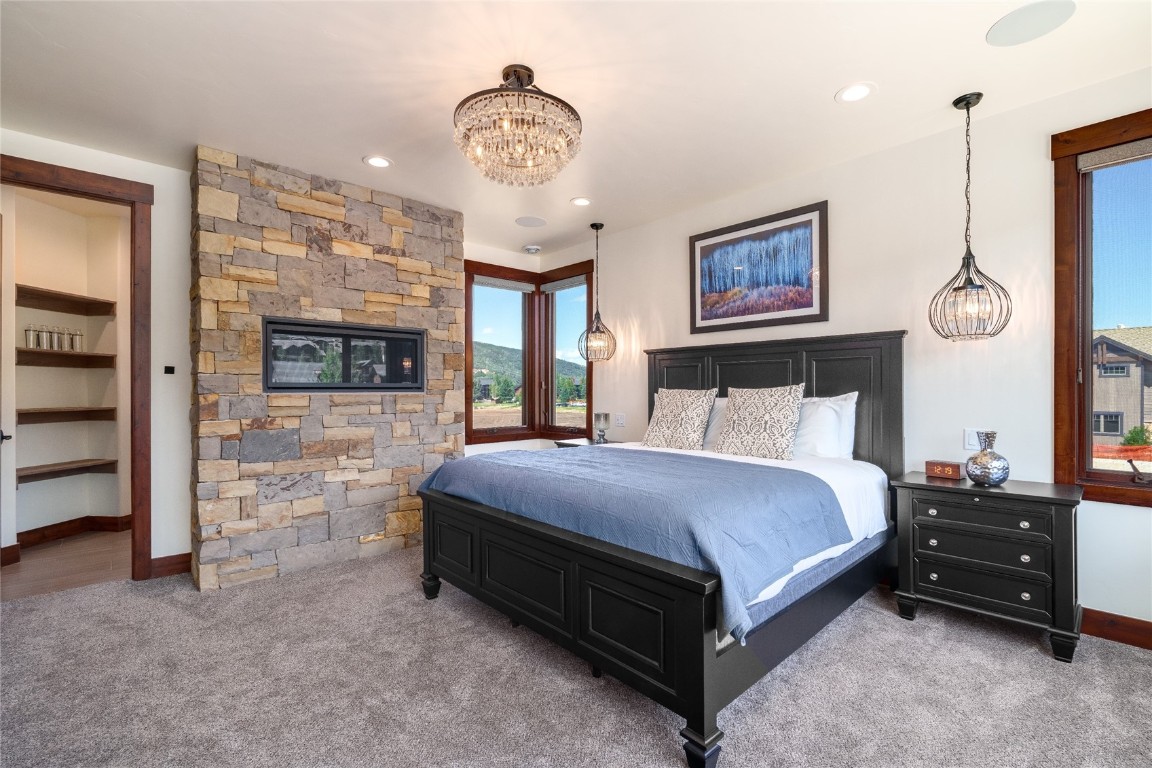 2669 Bronc Buster Loop Steamboat Springs, CO 80487 - Photo 17 of 49 a bedroom with a bed and a walk in closet