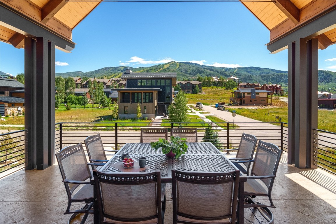 2669 Bronc Buster Loop Steamboat Springs, CO 80487 - Photo 5 of 49 a view of a balcony dining table and chairs